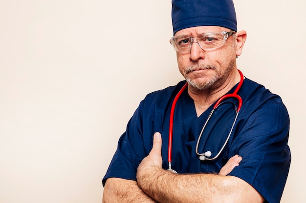  portrait of a veteran doctor in an operating room suit