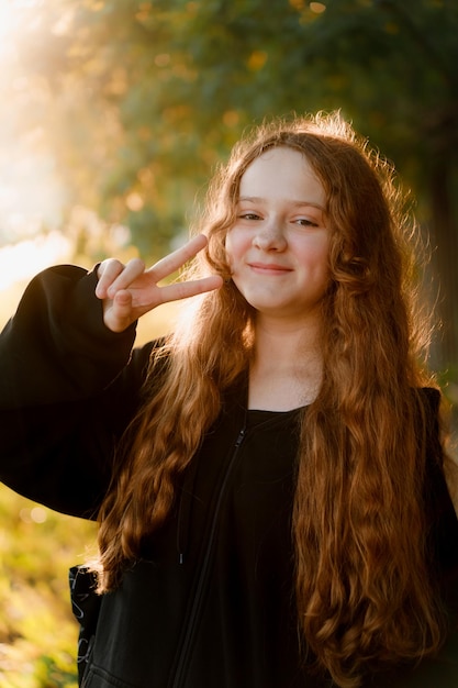 Portrait with cute girl in autumn park.