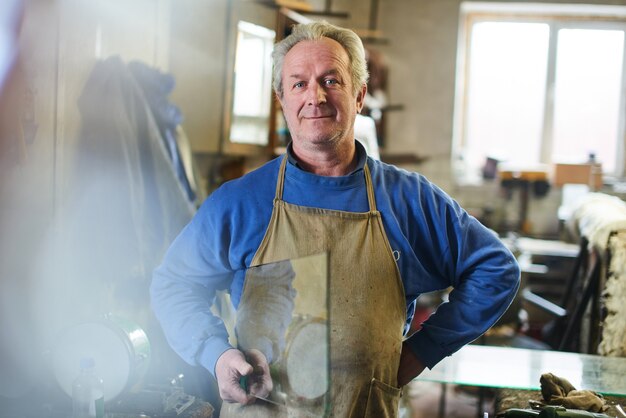 Portrait of the wizard in workshop for making glass