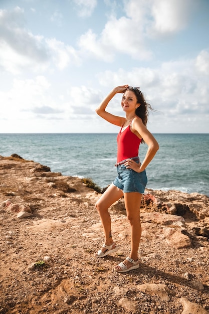 Portrait of a woman on the beach ocean unity with nature healthy lifestyle