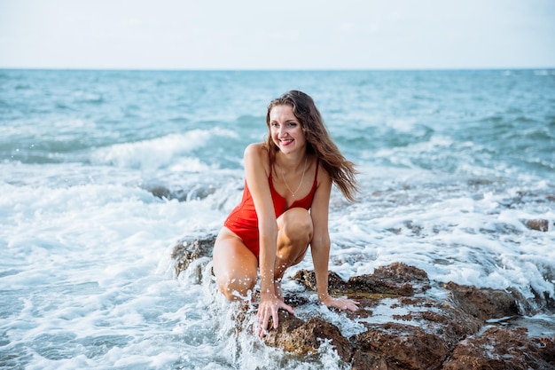 Portrait of a woman on the beach ocean unity with nature healthy lifestyle