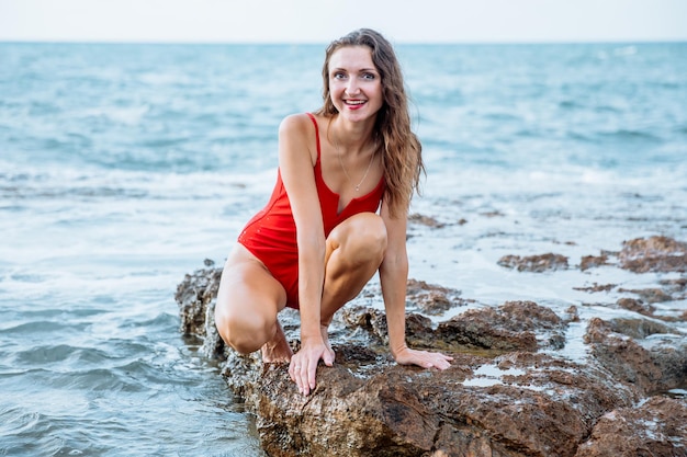 Portrait of a woman on the beach ocean unity with nature healthy lifestyle