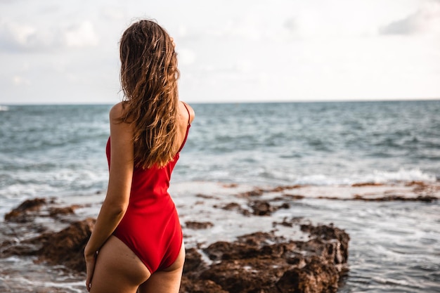 Portrait of a woman on the beach ocean unity with nature healthy lifestyle