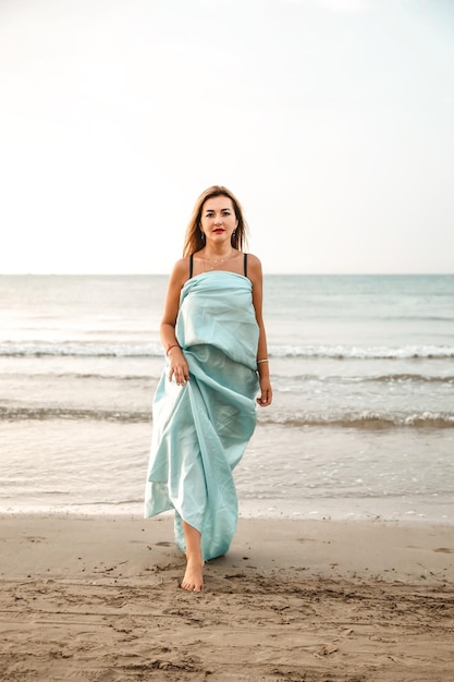 Portrait of a woman on the beach ocean unity with nature healthy lifestyle