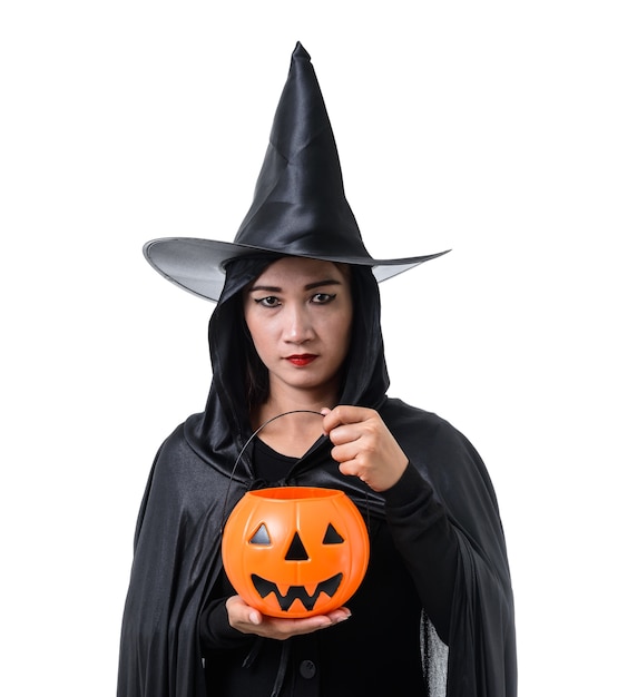 Portrait of woman in black Scary witch halloween costume standing with hat 