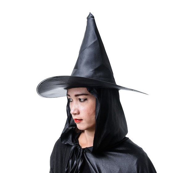 Portrait of woman in black Scary witch halloween costume standing with hat 