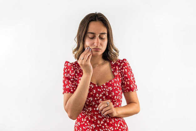 Portrait of a woman experiencing a painful toothache A woman with dental problems feels a toothache The concept of dental health care