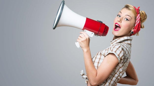 Portrait of woman holding megaphone