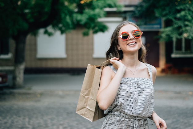 portrait woman holding shopping bags