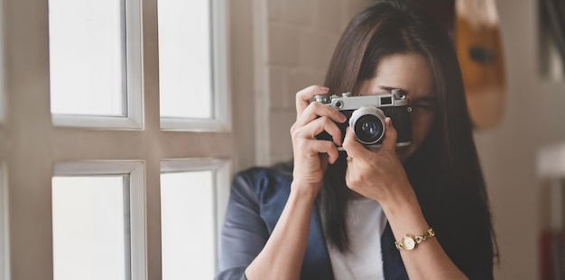 Portrait of woman photographing