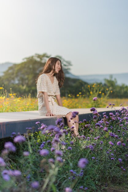 Portrait of woman posing in the flower garden