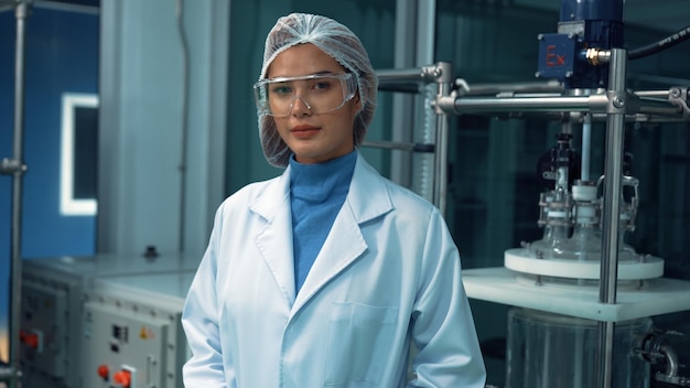 Portrait of a woman scientist in uniform working in curative laboratory