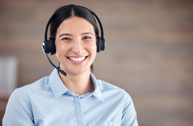 Portrait woman and smile in call center for telemarketing customer service and advisory contact CRM help and FAQ support Face microphone and happy telecom consultant for sales IT and questions