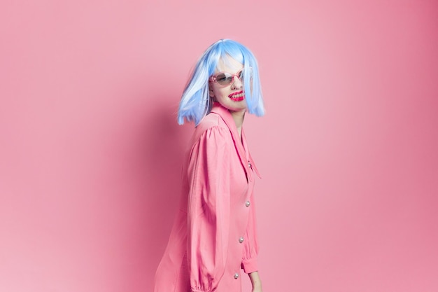 Portrait of a woman in sunglasses wears a blue wig makeup Lifestyle posing