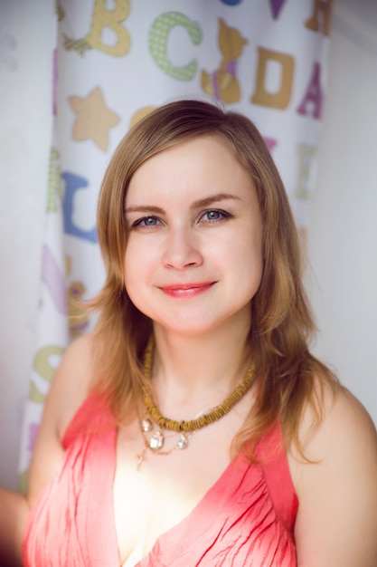 Portrait of woman in a sunny room