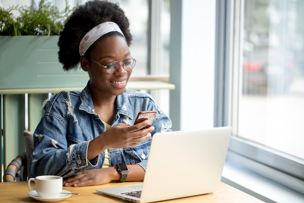 Portrait of a woman using her phone