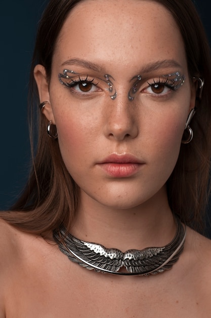 Portrait of woman wearing jewelry makeup