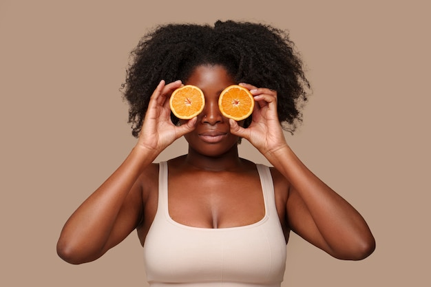 Portrait of woman with citrus for beauty