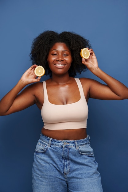 Portrait of woman with citrus for beauty