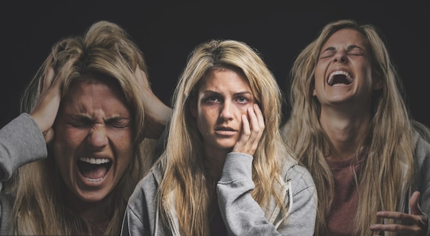 Portrait of a woman with depression schizophrenia and mental health problem Mockup for person with mental illness bipolar disorder and anxiety Angry screaming and depressed crying girl in studio