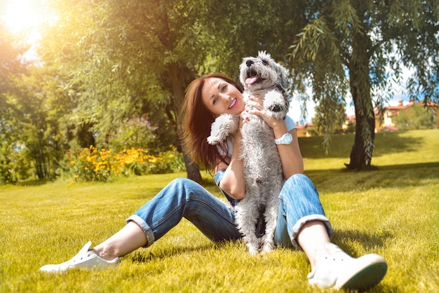 Portrait woman with dog in park