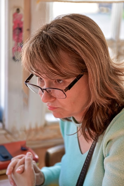 Portrait of a woman with glasses in the office