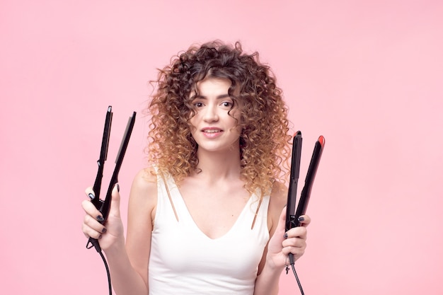 portrait woman with hair straightener