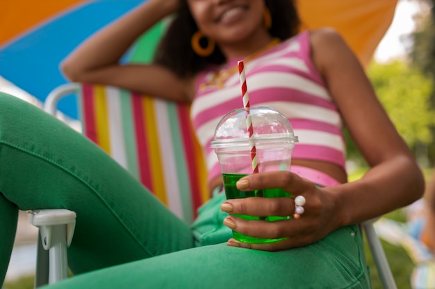 Portrait of woman with slurpee