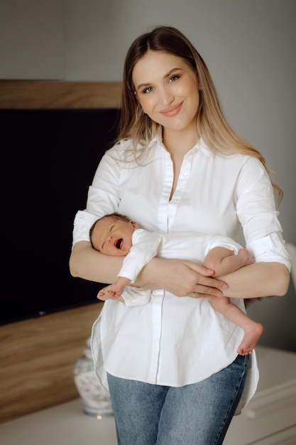 Portrait of a woman with a small child in his arms