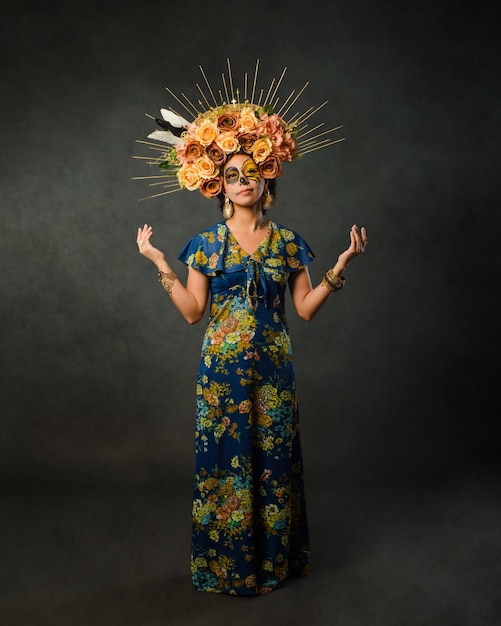 Portrait of a woman with sugar skull makeup Catrina with butterfly painted on her face