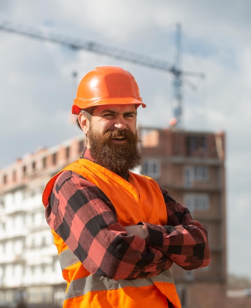 Portrait of worker man at construction site industrial theme