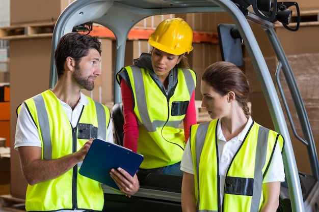 Portrait of workers are looking a clipboard