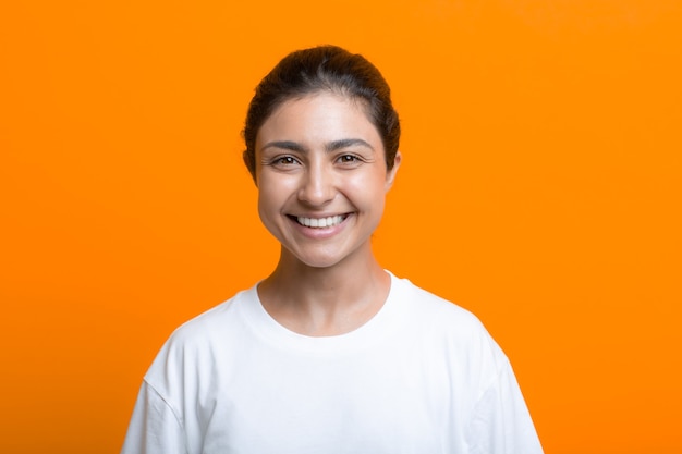 Portrait of young adult indian woman in T-shirt.