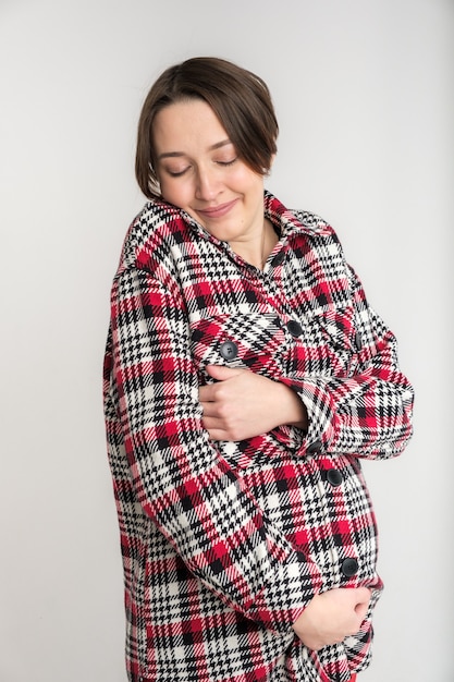 Portrait of young adult woman in warm home clothes