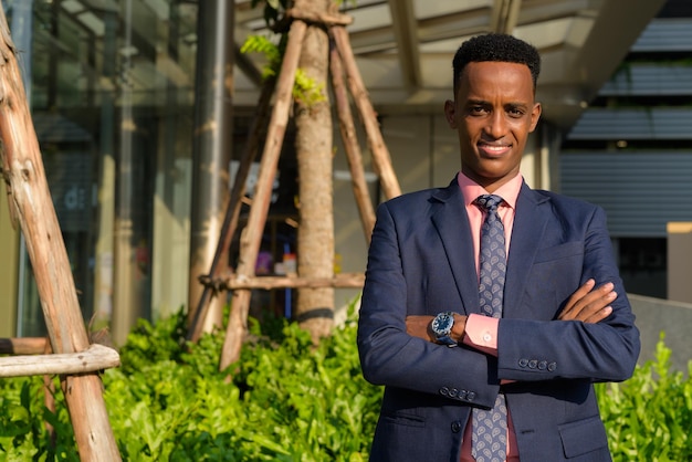 Portrait of young African businessman wearing suit and tie