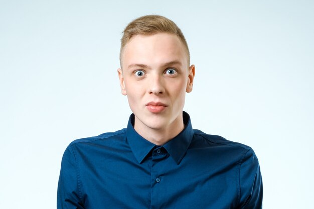 Portrait of young amazed man