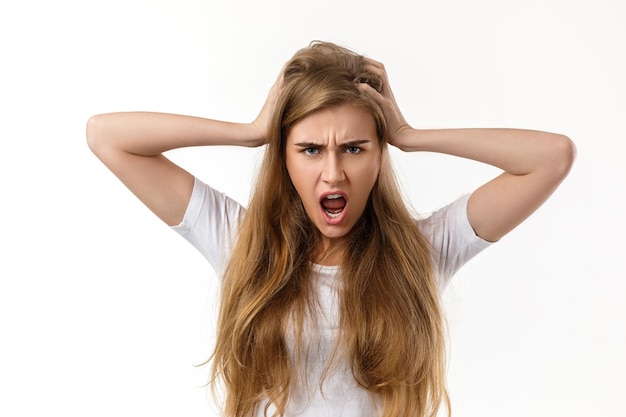 Portrait of young angry woman screaming