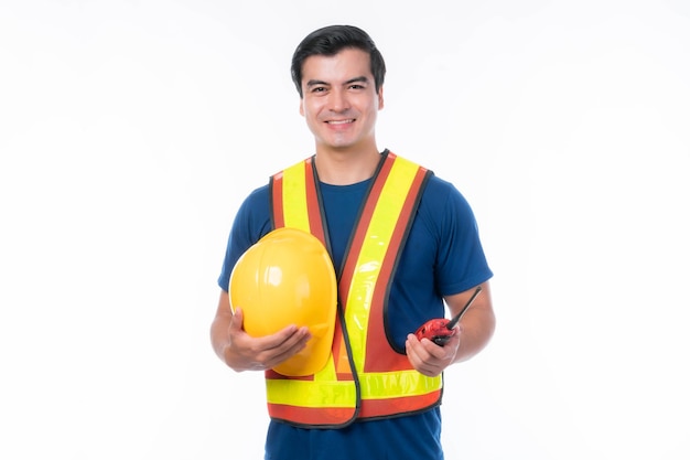 Portrait young architect man engineering holding yellow helmet and megaphone in hand He standing arms crossed isolated on white background with copy space