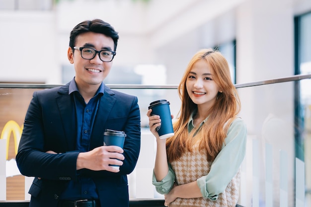 Portrait of young Asian business people at office