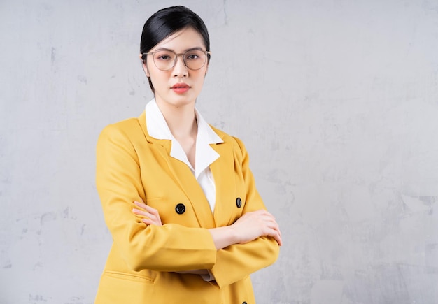 Portrait of young Asian businesswoman on background