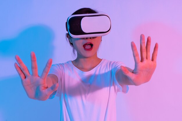 Portrait of young asian girl wearing virtual reality glasses