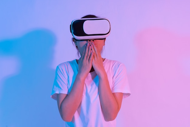 Portrait of young asian girl wearing virtual reality glasses