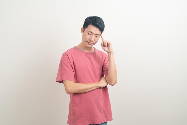 portrait young Asian man thinking on white background