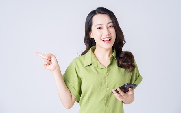 Portrait of young Asian woman on background