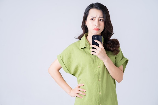 Portrait of young Asian woman on background