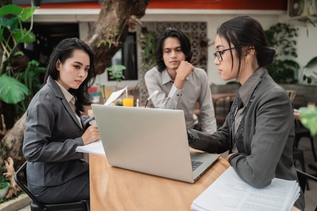 Portrait of young asian young business team meeting in a cafe