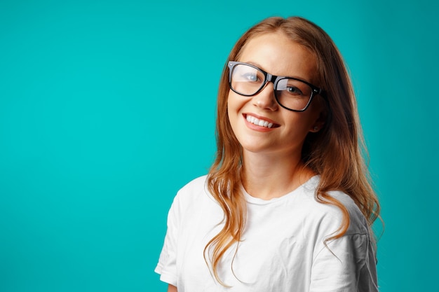 Portrait of a young attractive caucasian woman in glasses close up