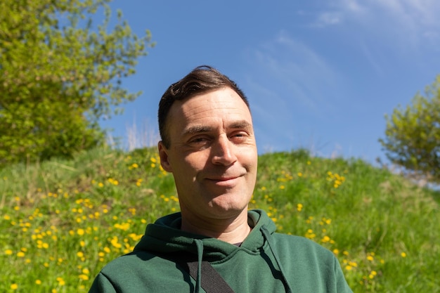 Portrait of a young attractive man in the nature