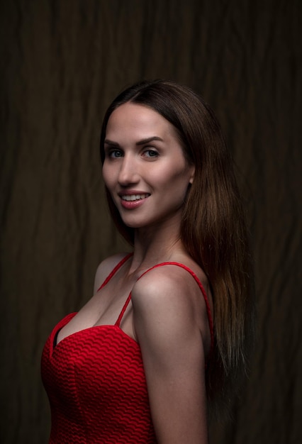 portrait of a young attractive woman on a dark background