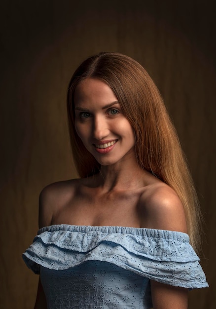 portrait of a young attractive woman on a dark background